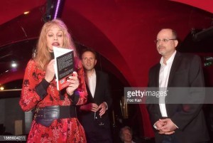 PARIS, FRANCE - MARCH 15: (L-R) Arielle Dombasle, Jerome Attal and Mikael Hirsch, Prix Castel Du Roman De La Nuit awarded writer, attend the Prix Castel 2022 Du Roman De La Nuit award ceremony at Castel Club on March 15, 2022 in Paris, France. (Photo by Foc Kan/WireImage)