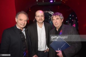 PARIS, FRANCE - MARCH 15: (L-R) Salon du Livre et du Vin de Saumur president Jean Maurice Belayche, Mikael Hirsch, Prix Castel Du Roman De La Nuit awarded writer, for his book 'L’Assassinat de Joseph Kessel' and his editor Serge Safran attend the Prix Castel 2022 Du Roman De La Nuit award ceremony at Castel Club on March 15, 2022 in Paris, France. (Photo by Foc Kan/WireImage)